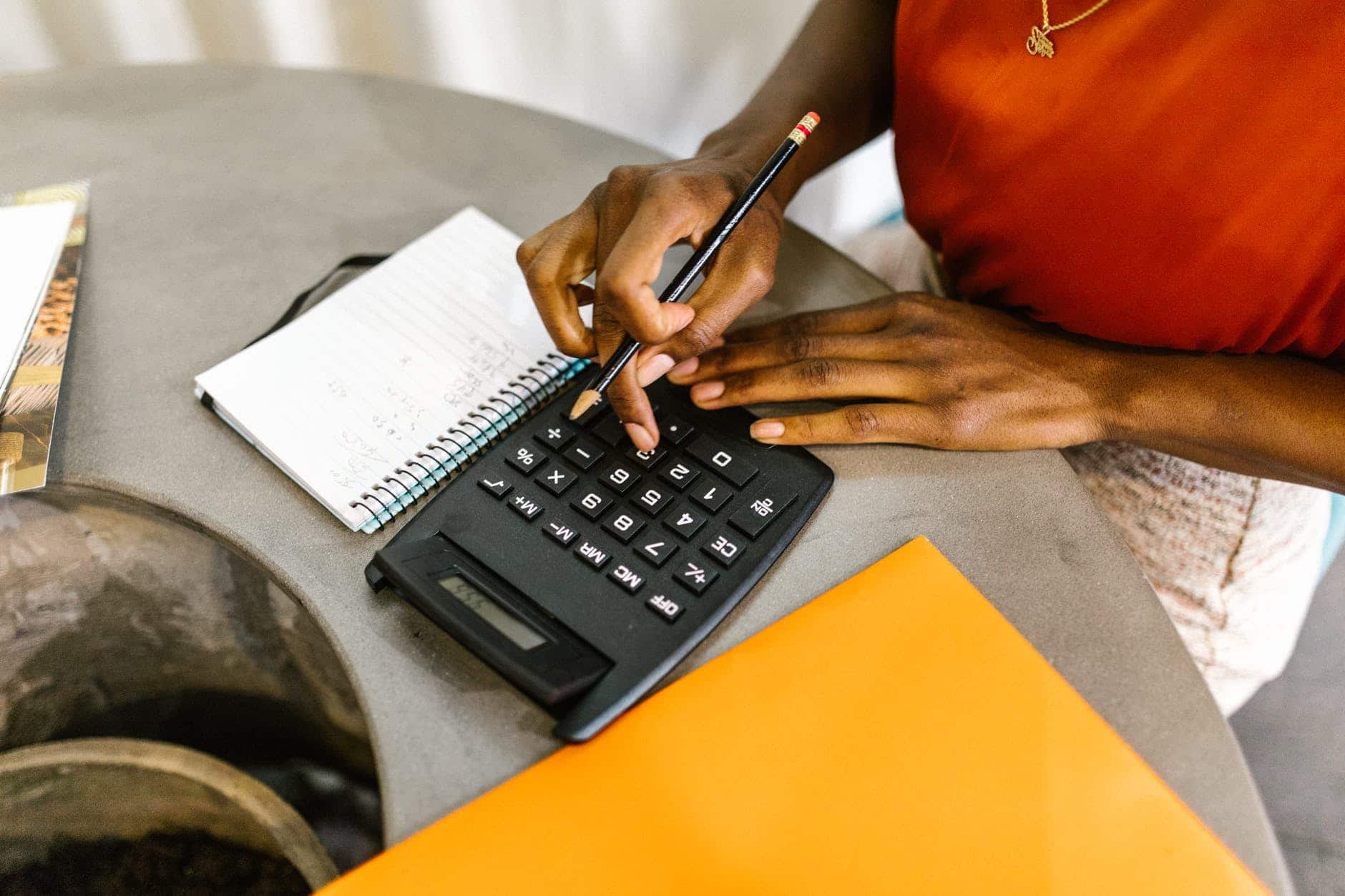 woman uses calculator